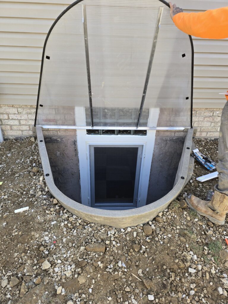 Exterior window well with cover open