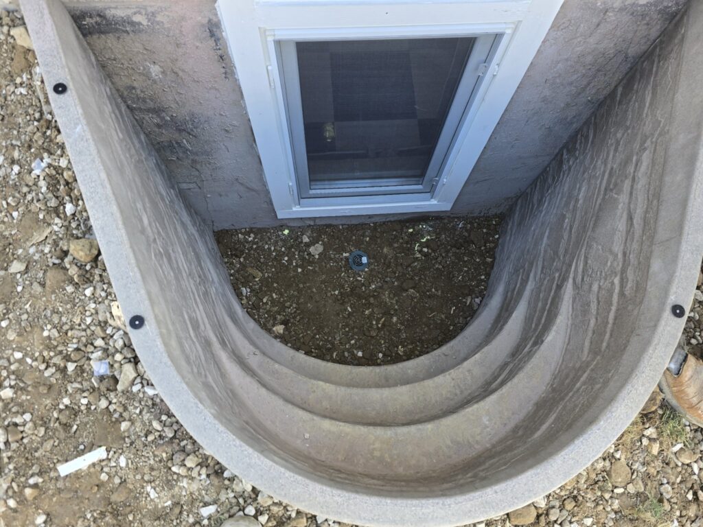 Window well top-down view showing drain