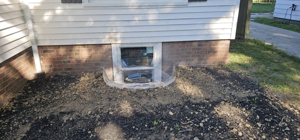 Crew installing egress window