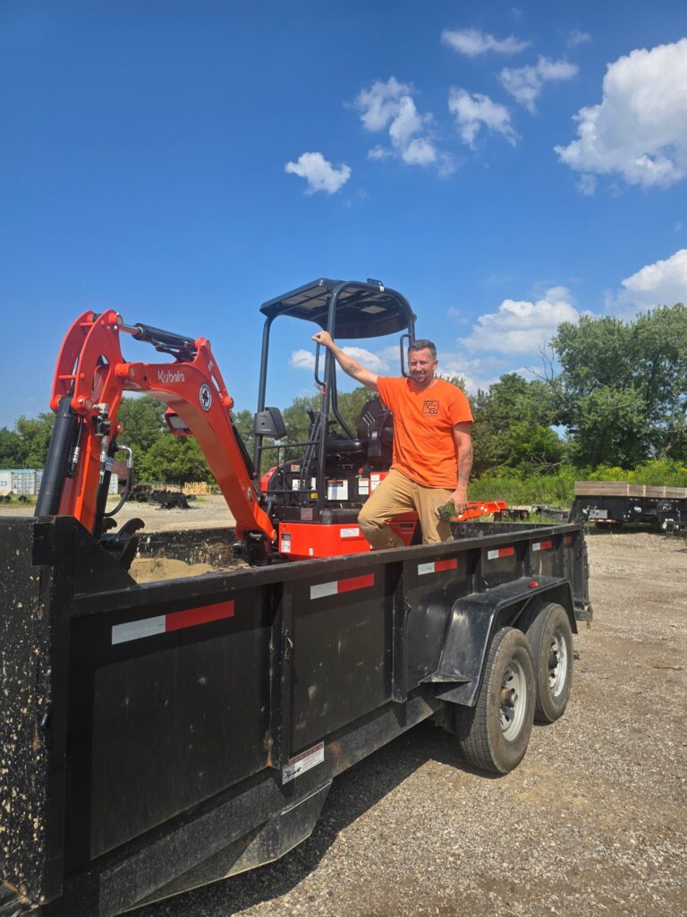 Matt Leitch with the Kubota mini excavator used to dig egress window wells