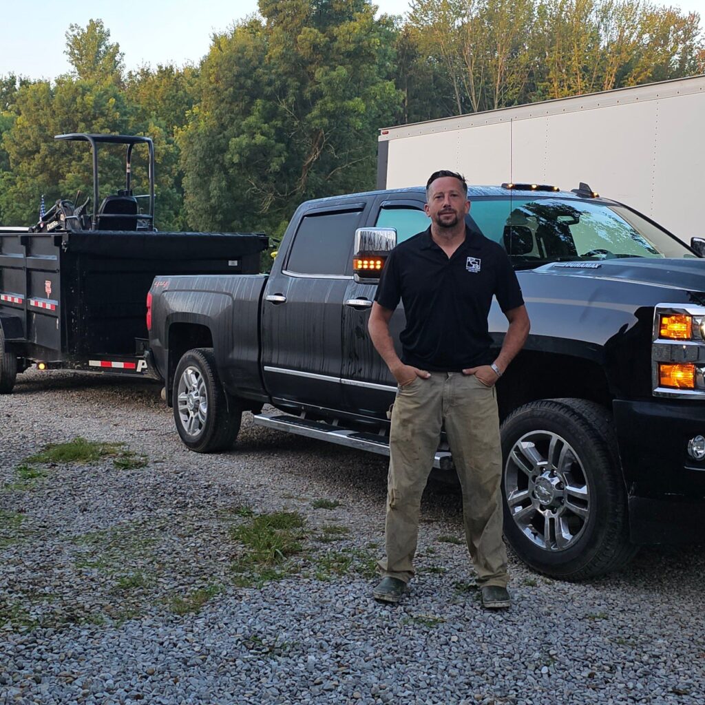 Matt Leitch, owner of North Coast Egress, in front of the work truck